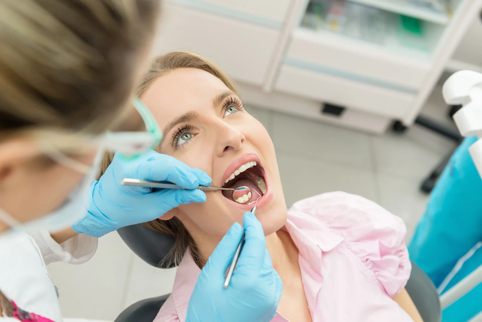 Dentist performing a routine dental examination